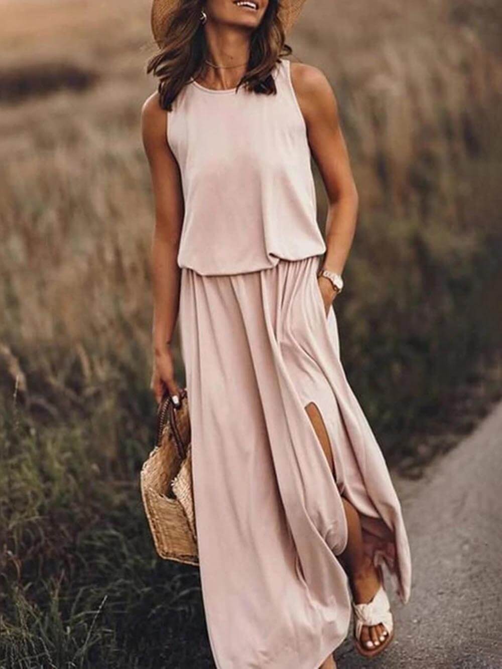 Loose fitted dress with round neck and sleeveless slit