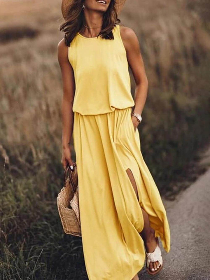 Loose fitted dress with round neck and sleeveless slit